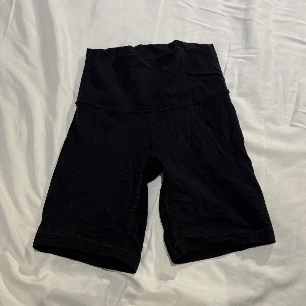 TNA Butter 7 inch inseam black cheeky biker shorts high rise